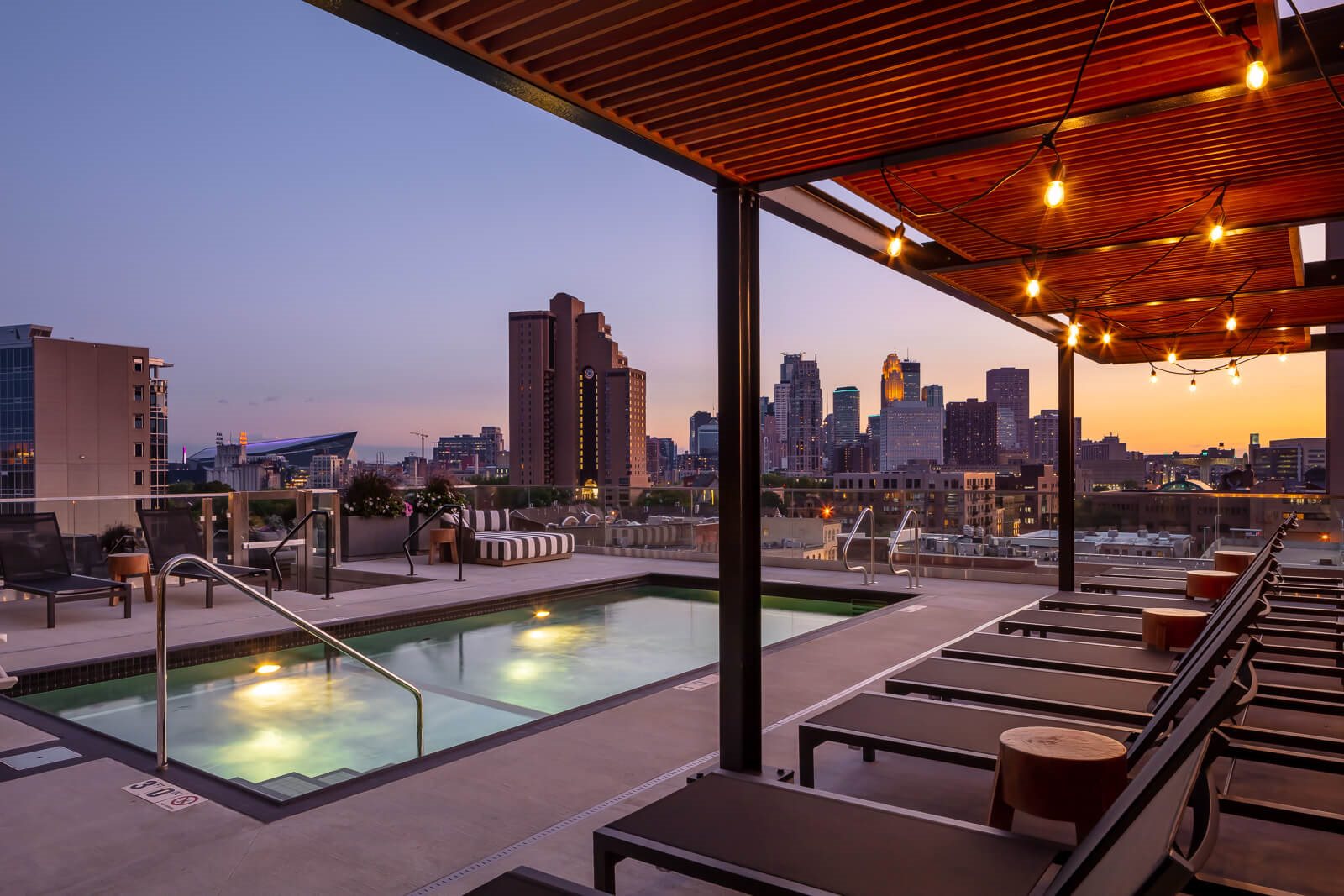 Pool deck and seating overlooking Minneapolis skyline